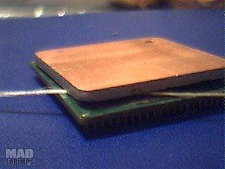 尼龙绳翘开Pentium4处理器散热盖